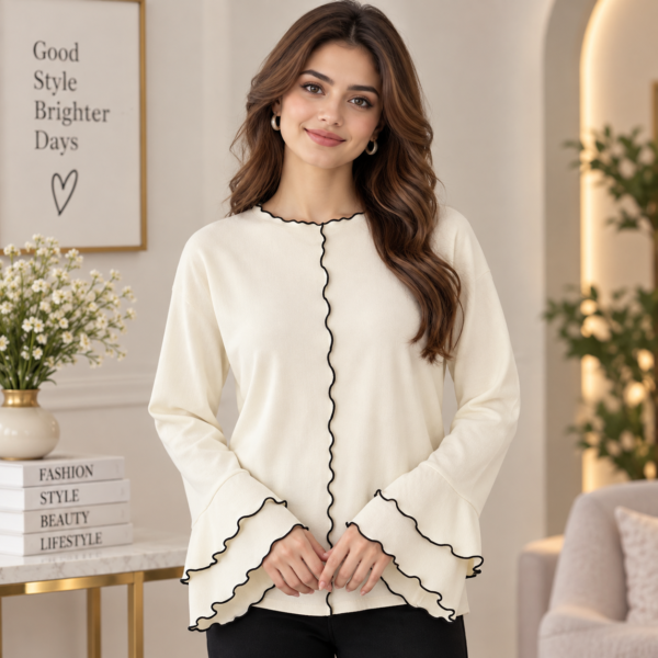 Women’s cream long sleeve top with black wavy contrast trim