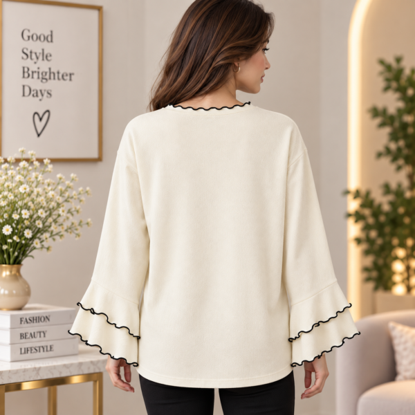Women’s cream long sleeve top with black wavy contrast trim